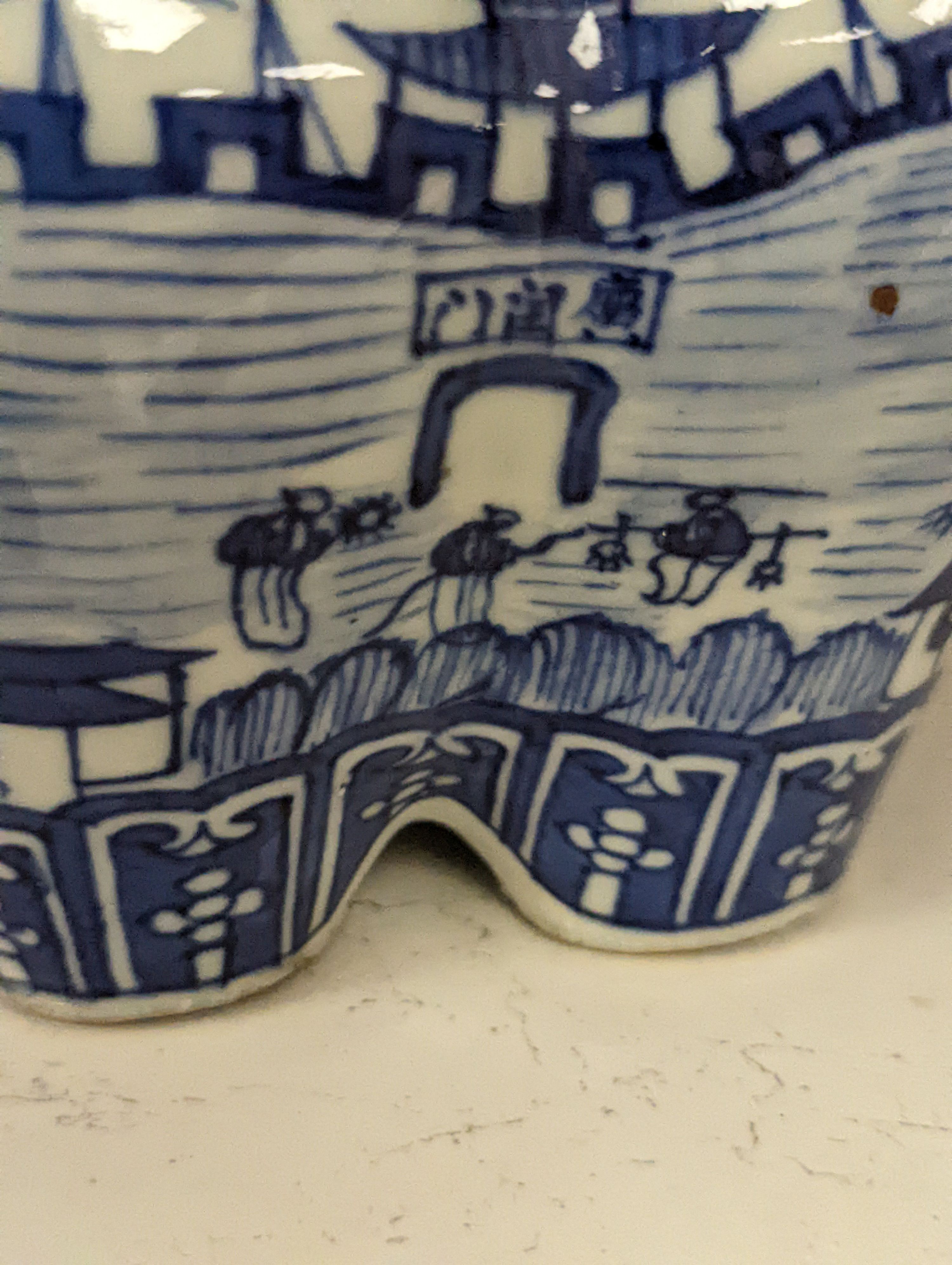 A 19th century Chinese blue and white tulip vase, painted with the pavilion of Prince Teng - 24cm high